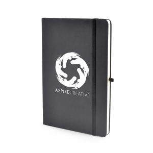 A5 black PU soft finish notebook with 80 plain sheets, coloured elastic closure, pen loop and bookmark. Back pocket to store loose notes. Available in black.