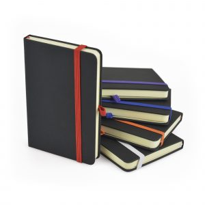 A6 black PU soft finish 80 sheet lined notebook with coloured bookmark, back pocket for securing loose notes, coloured elastic pen loop with coloured elastic closure. Available in 10 colours.