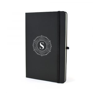 A5 mole notebook with antibacterial coating for extra safety! Includes 80 lined pages, pen loop, bookmark, elastic closure and rear pocket. Available in black only.