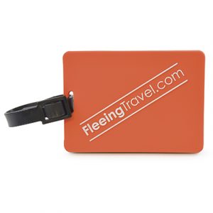 Rectangular, moulded PVC luggage tag with rubber strap. Reverse has framed viewing window with a pull out address label.