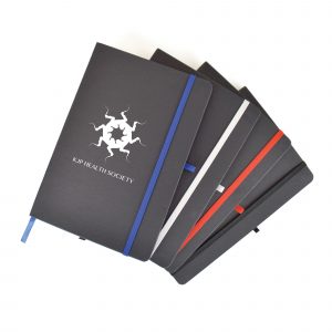 A5 black notebook with 90 white lined pages and coloured bookmark, pen loop and elastic closure.