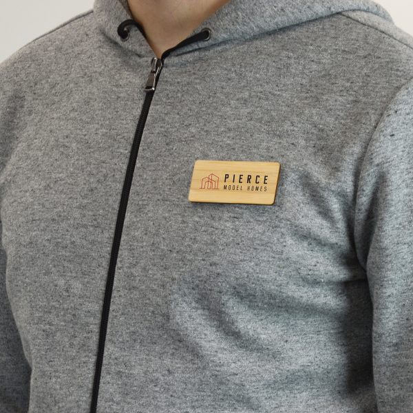 Sustainable bamboo rectangle badge with large personalisation area. Magnet attachment on the reverse for attaching to clothing.