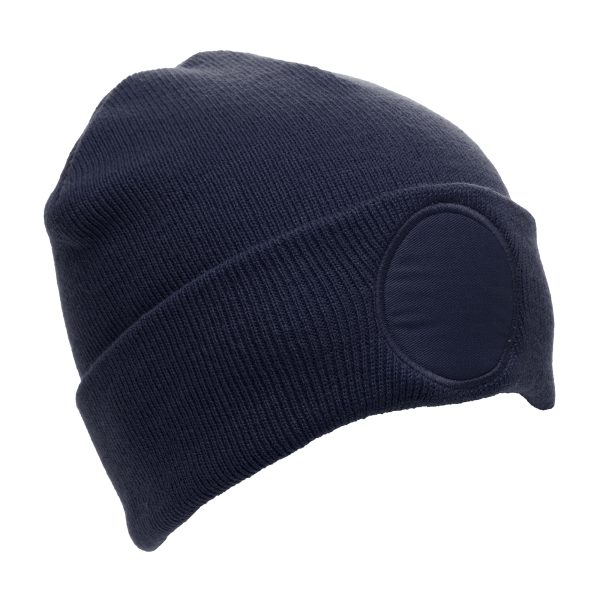 Crafted from 100% soft-touch acrylic with double layer knit, and a circular polyester patch for smooth and easy customisation. With a 6cm diameter patch that is perfect for decoration, this one-size beanie allows your company logo to standout and be recognised. Available in a range of colours.
