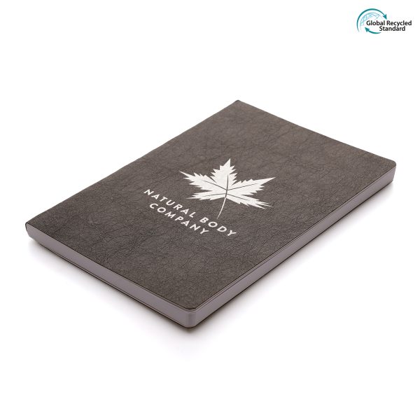 An eco-friendly notebook with Kraft paper and cardboard textured finished cover and 96 white lined recycled paper sheets. All materials are recycled or widely recyclable.