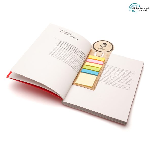 A bamboo bookmark with colourful sticky notes made from recycled paper and cm/inch ruler to the edge.
