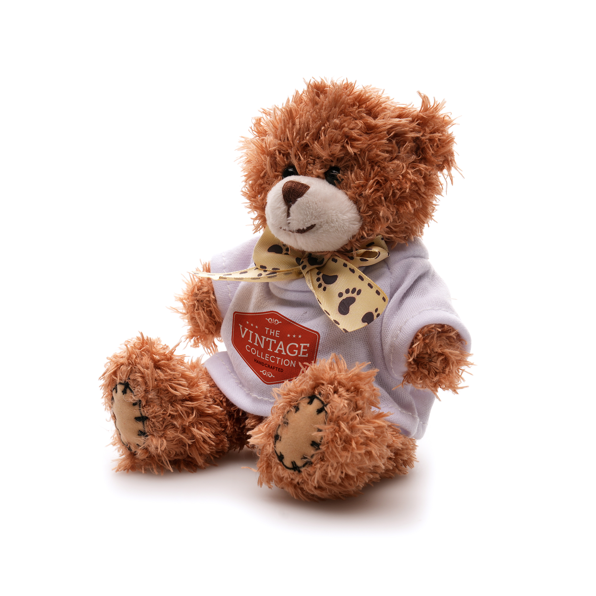 Crafted with polyester fabric and a charming ribbon neck tie for added elegance, this 12cm teddy bear comes with cotton filler, embroidered thread nose and mouth, suede hands, ear pads and plastic eyes adding a delightful tactile element.
