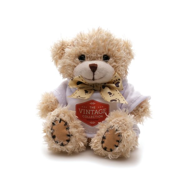 Crafted with polyester fabric and a charming ribbon neck tie for added elegance, this 12cm teddy bear comes with cotton filler, embroidered thread nose and mouth, suede hands, ear pads and plastic eyes adding a delightful tactile element.