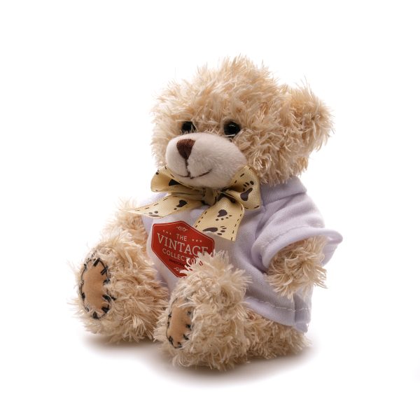 Crafted with polyester fabric and a charming ribbon neck tie for added elegance, this 12cm teddy bear comes with cotton filler, embroidered thread nose and mouth, suede hands, ear pads and plastic eyes adding a delightful tactile element.