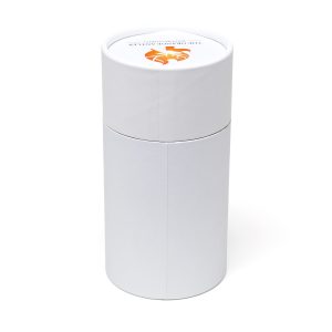 A white cylinder drum-style pot featuring a vibrant, digitally printed wraparound label (lid label option available at additional cost). The kit includes two Cocopress® compost tablets, a seed packet of your choice with an extensive range to choose from. Growing instructions are printed on the base of the seed drum.