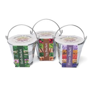 Silver metal mini bucket with handle, containing a Cocopress® compost tablet and a seed packet (wide variety of seeds available). Supplied with a choice of a Herb, Vegetable or Flower pre-printed sleeve with sowing instructions to the side and features your branding to a label on the top.