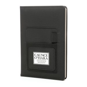 PU notebook with 80 lined sheets, ribbon bookmark, pen loop and phone holder pocket with branded panel to the front.