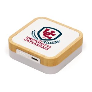 Wireless charger crafted from bamboo and recycled ABS plastic, delivering 15W fast-charging power. The integrated LED base light adds a stylish touch, making it perfect for travel. Includes a generous branding area to showcase your company logo and comes with a USB-C cable.