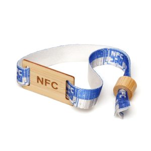 RPET 15mm ribbon wristband with wooden adjustable closing clip and full colour dye sublimation to one or both sides. Featuring wooden plate embedded with NFC chip that instantly share links, contact details, or digital content with just a tap on any compatible device.